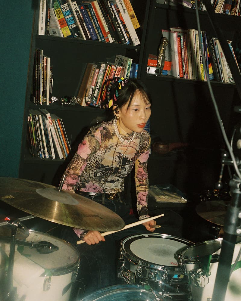 Yue Shi playing drums at Green Auto Studios